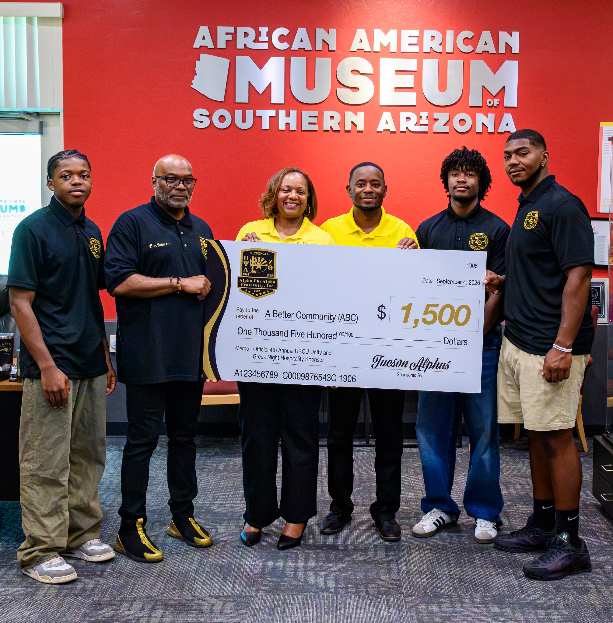 Tucson Alphas and community partners presenting a $1,500 sponsorship check to A Better Community at the African American Museum of Southern Arizona